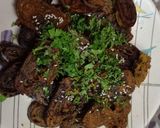 A picture of step 6 of Homemade crispy Patra with some spicy green chutney.