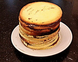 A picture of step 12 of 12 Layer Vanilla Sponge Cake.
