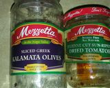 A picture of step 1 of Sun dried tomatoes and Olive bread dip.