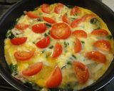 A picture of step 4 of Spinach, Tomato, and Cheese Western Omelet.