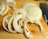A picture of step 1 of Taisen's cucumber and onion salad.