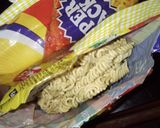 A picture of step 3 of Indomie with potato and dried fish.