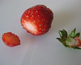 A picture of step 11 of Cocoa Crepe Roll Cake with Whole Strawberries.