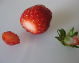 A picture of step 11 of Cocoa Crepe Roll Cake with Whole Strawberries.