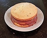 A picture of step 13 of Vanilla Chip Layer Cake with Cherry Curd Filling.