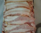 A picture of step 9 of Bacon wrapped meatloaf, stuffed with garlicky mashed potatoes.