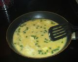 A picture of step 3 of Buttery croissant filled with green onion egg and cheese mixture.