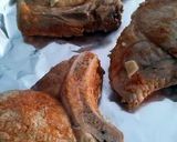 A picture of step 5 of pork shops in creamy white wine sauce.