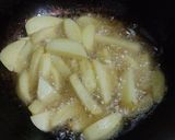 A picture of step 1 of Baingan and Aloo fry.
