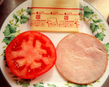 A picture of step 1 of Toast with Ham, Tomatoes, and Cheese.