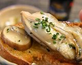 A picture of step 6 of Oyster al Ajillo.