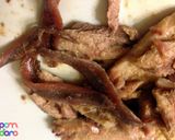 A picture of step 2 of Crostini di Pesce/ Sardine and anchovy garlicky appetizer.