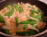 A picture of step 5 of Sweet Onion and Snow Peas with Fluffy Scrambled Eggs.