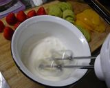 A picture of step 9 of Strawberry, Kiwi, and Peach Mille Crêpes Cake.