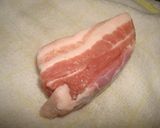 A picture of step 1 of Homemade Bacon Smoked with Barley Tea in a Pot.