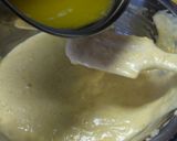 A picture of step 9 of Fluffy Madeleines with Orange Peels.