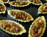 A picture of step 7 of Crunchy Mini Nut Tarts.