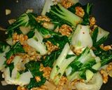 A picture of step 8 of Walnut stir-fry Bok Choy.
