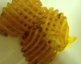 A picture of step 5 of Layered Bacon Chili Cheddar Cheese Waffle Fries.