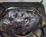 A picture of step 2 of Baingan ka bharta.