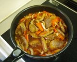 A picture of step 9 of Pork Fillets with Vegetable Sauce.