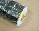 A picture of step 7 of Teriyaki Pork Sushi Rolls.