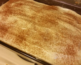 A picture of step 16 of Cinnamon Roll Poke Cake.