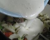 A picture of step 14 of Easy Rich Cream Stew in a Le Creuset Pot.