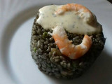 Arroz negro con gambas, pota y salsa alioli