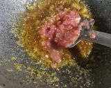 A picture of step 3 of Koi komola, climbing fish curry with orange juice.