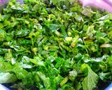 A picture of step 1 of Sarso ka saag with makki roti.