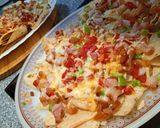 A picture of step 5 of Mexican Nachos with Peppers, Onion, and Bacon.