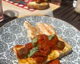 Foto del paso 5 de la receta: Pan pizza con tomates cherry asados, mozzarella y albahaca