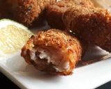 A picture of step 10 of Fish fingers served with French fries.