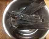 A picture of step 1 of Golden Dashi Stock with Konbu and Bonito Flakes.