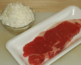 A picture of step 1 of Beef Steak with Onion Sauce.