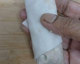 A picture of step 4 of ChickenSpring rolls.