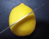 A picture of step 2 of How To Cut Lemon Wedges.