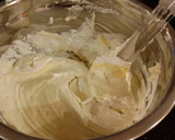 A picture of step 11 of Vanilla Layer Cake with Lemon Cream Filling and Lemon Whipped Cream Frosting.