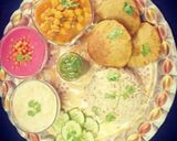 A picture of step 7 of Punjabi Thali / Choley Puri, Boondi Raita, Beetroot Raita, Rice.