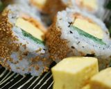 A picture of step 11 of California Roll using Grilled Salmon.