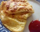 A picture of step 6 of 3 egg and cheese omelette.