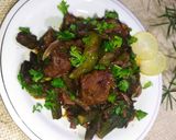 A picture of step 10 of Bhindi Gosht (okra).