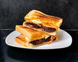 A picture of step 8 of My Smokey Bacon, Black Pudding & fried Egg Toasted Sandwich 🥰.