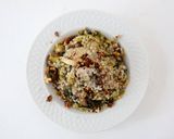 A picture of step 5 of Toasted Barley Pilaf with Mixed Mushrooms and Leeks topped with Manchego Cheese and Toasted Walnuts.