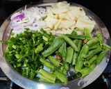 A picture of step 1 of Runner beans and potato fry with onion and onion greens.