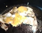 A picture of step 3 of Spicy eggs, with sausage.