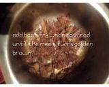 A picture of step 2 of Fried black beans (njahi).