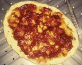 A picture of step 2 of Tex's 2 Pig Pizza 🍅🐷🧀🍕🌿.