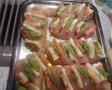 A picture of step 5 of Stuffed chicken witb basil mozzarella and tomato.
